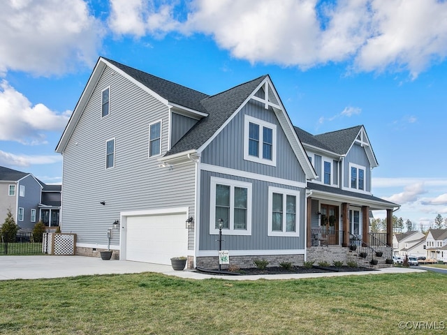 craftsman-style house with covered porch, a garage, and a front yard