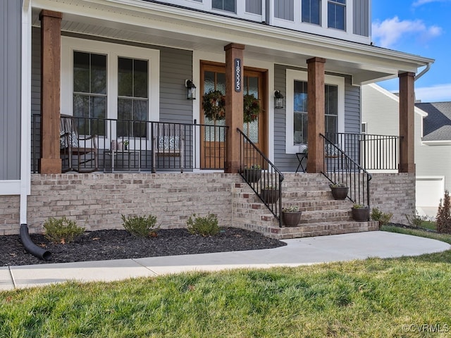 property entrance featuring covered porch