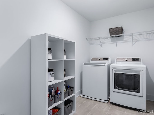 washroom with laundry area, tile patterned flooring, and separate washer and dryer