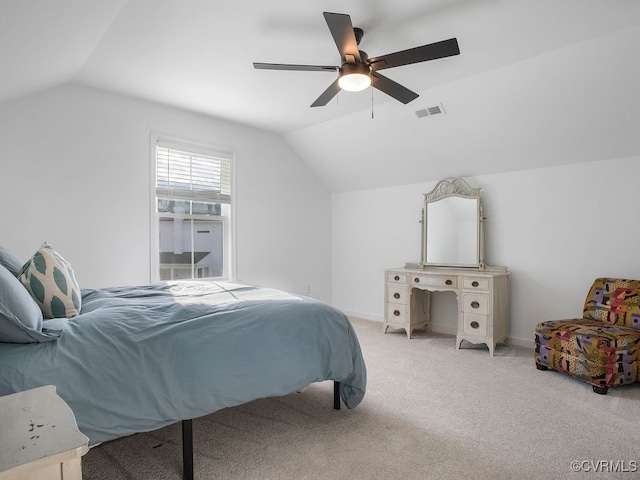 bedroom featuring light carpet, baseboards, visible vents, a ceiling fan, and lofted ceiling