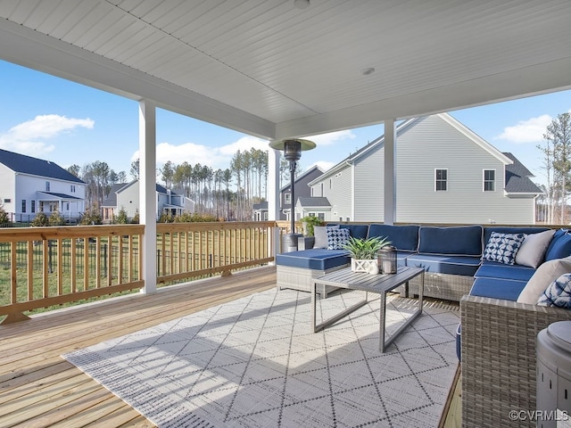 wooden deck featuring a residential view and outdoor lounge area