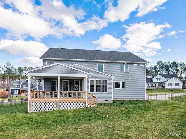 back of property featuring a yard, crawl space, and fence