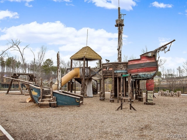 communal playground featuring fence