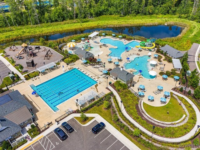 birds eye view of property with a water view