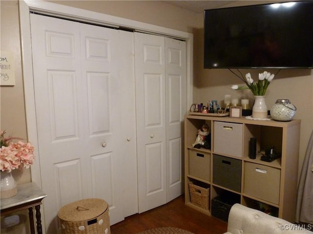 bedroom with dark hardwood / wood-style flooring