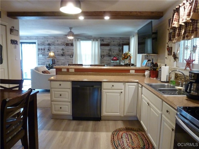 kitchen with dishwasher, white cabinetry, plenty of natural light, and sink