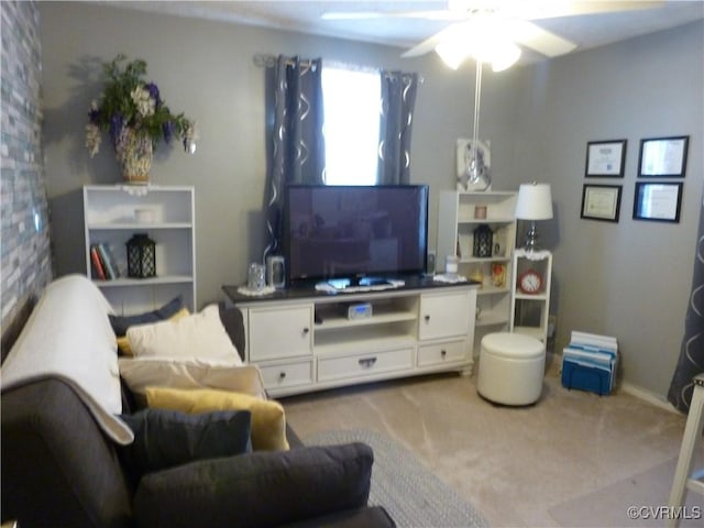 carpeted living room with ceiling fan