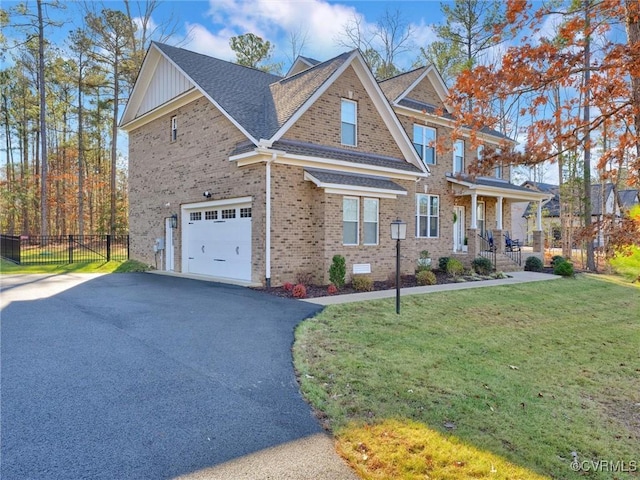 craftsman-style home featuring a front yard and a garage