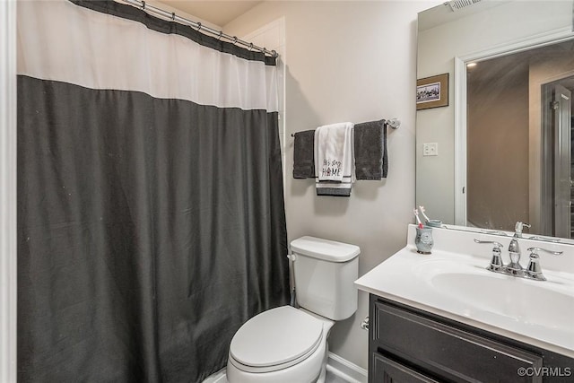 full bathroom featuring toilet and vanity