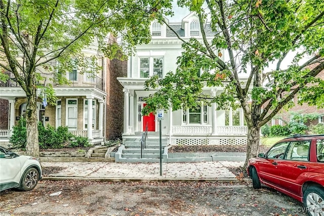 view of front of property with a balcony