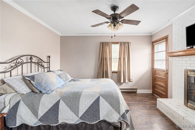 bedroom featuring dark hardwood / wood-style floors, a brick fireplace, ceiling fan, and ornamental molding