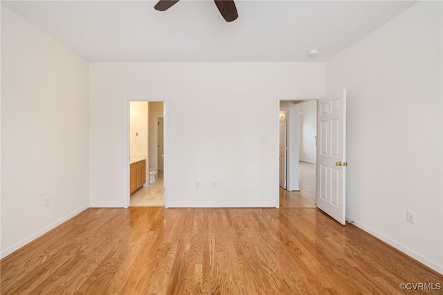 spare room featuring light wood-type flooring and ceiling fan