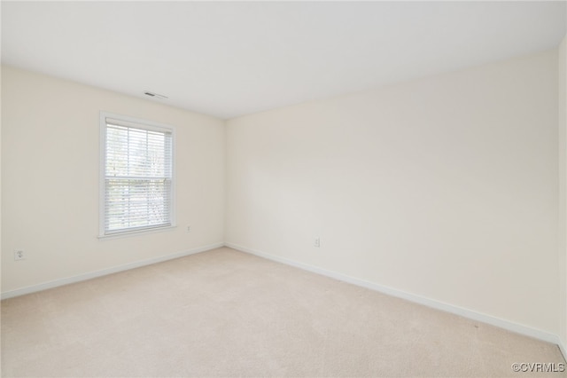 empty room with light colored carpet