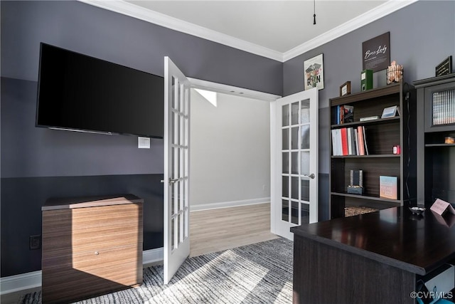 home office with wood-type flooring, ornamental molding, and french doors