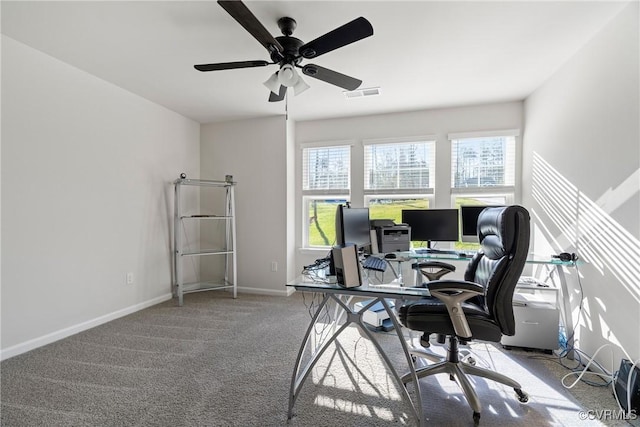 office space with ceiling fan and carpet