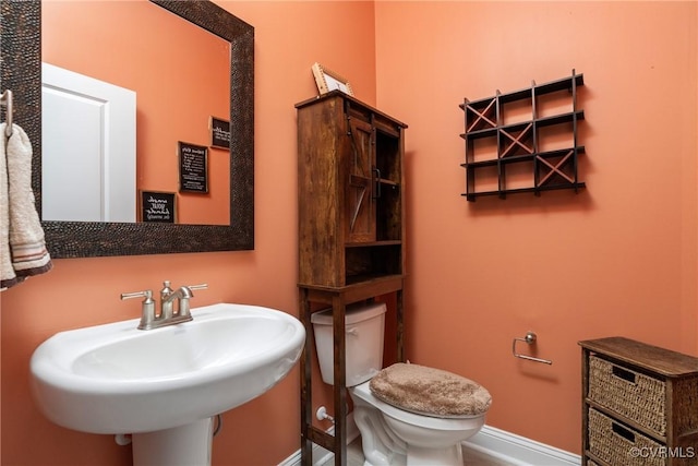 bathroom with sink and toilet