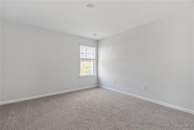 unfurnished room featuring carpet flooring