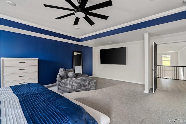 carpeted bedroom with ceiling fan and ornamental molding