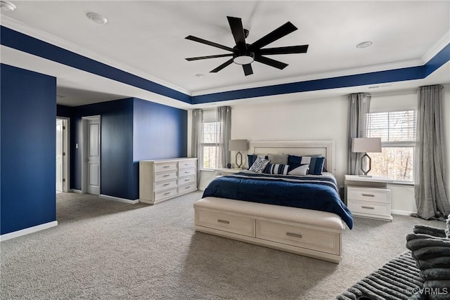 bedroom with ceiling fan, light colored carpet, ornamental molding, and multiple windows