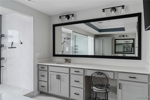 bathroom with a raised ceiling, a shower, crown molding, and vanity