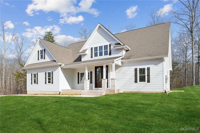 view of front of property with a porch and a front yard