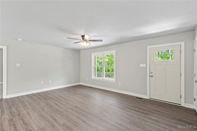 interior space featuring ceiling fan, dark hardwood / wood-style flooring, and a wealth of natural light