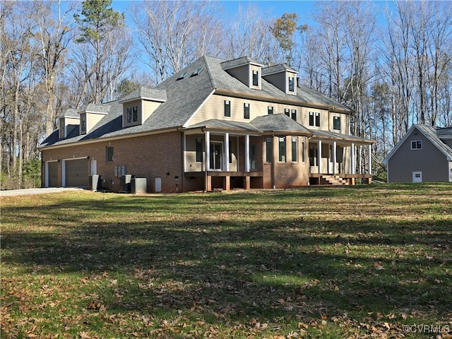 view of front of home featuring a garage and a front lawn