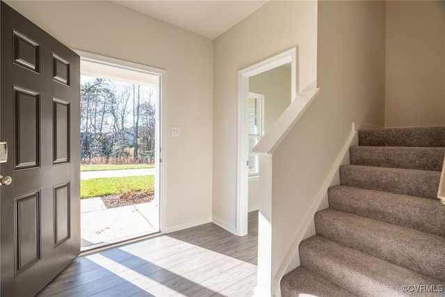 foyer entrance with light hardwood / wood-style floors