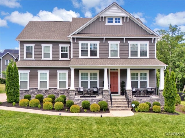 craftsman-style house featuring a front yard and a porch