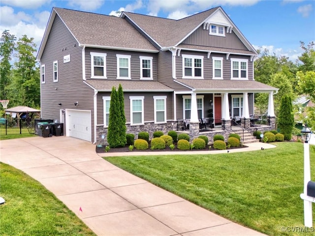 craftsman-style home with a porch, a garage, and a front lawn