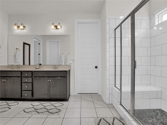 bathroom with tile patterned flooring, vanity, and an enclosed shower