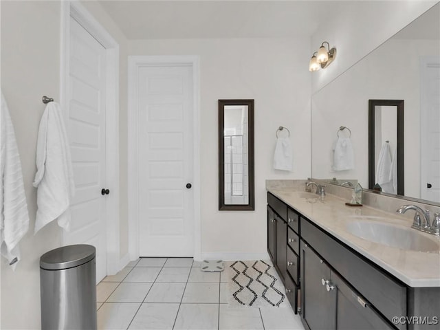 bathroom featuring tile patterned flooring and vanity