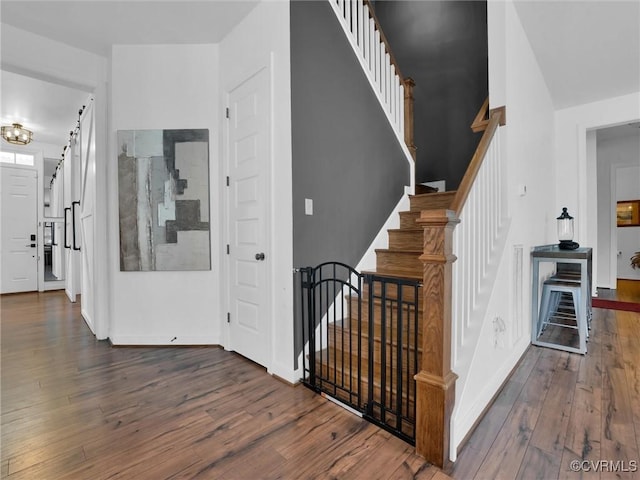 stairway featuring hardwood / wood-style floors