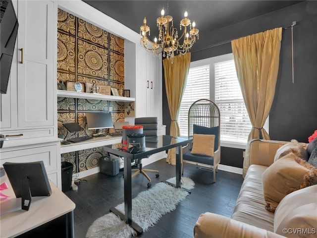 office with dark wood-type flooring and a notable chandelier