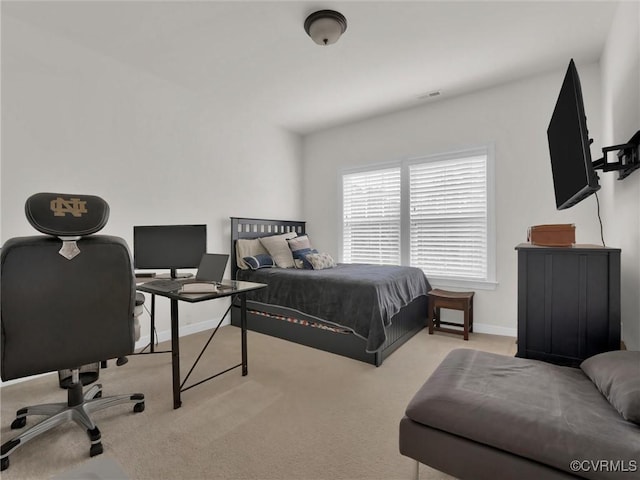 bedroom featuring light carpet