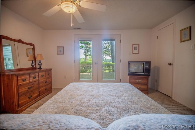 bedroom featuring access to outside, ceiling fan, french doors, and light carpet