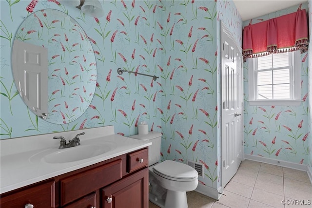 bathroom with vanity, tile patterned floors, toilet, and wallpapered walls