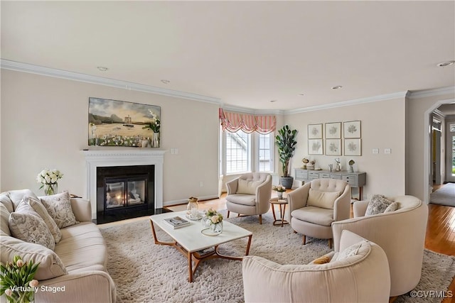 living room with hardwood / wood-style floors and ornamental molding