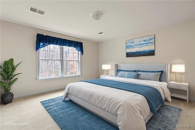 bedroom featuring baseboards, visible vents, and carpet flooring