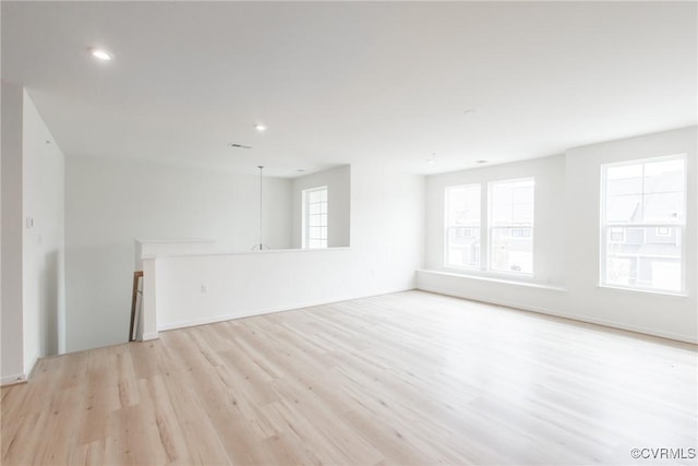 spare room featuring light hardwood / wood-style floors