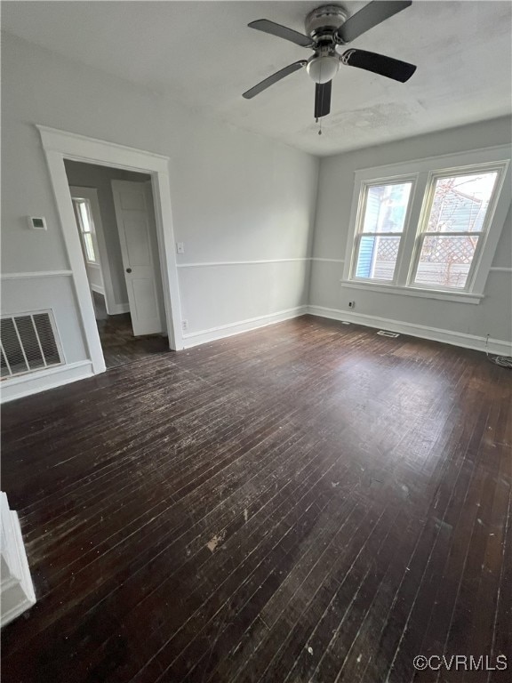 interior space with ceiling fan and dark wood-type flooring