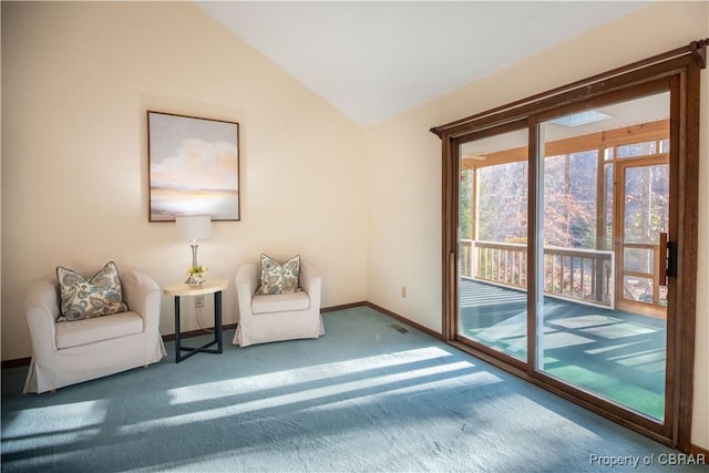 unfurnished room with carpet and vaulted ceiling