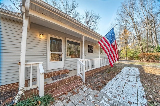 doorway to property with covered porch