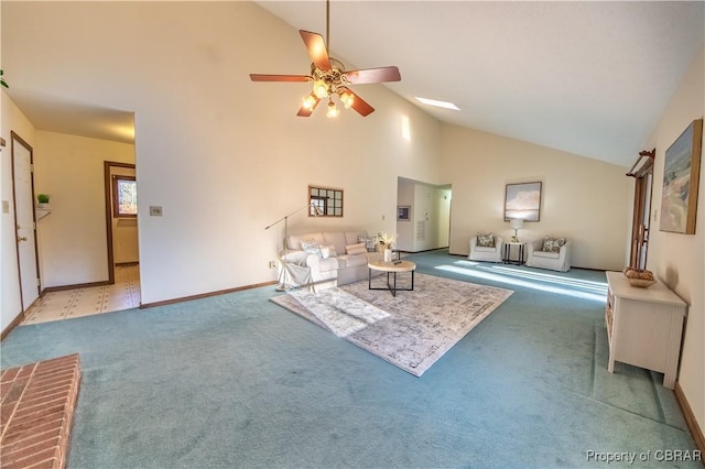 unfurnished living room with carpet flooring, high vaulted ceiling, and ceiling fan