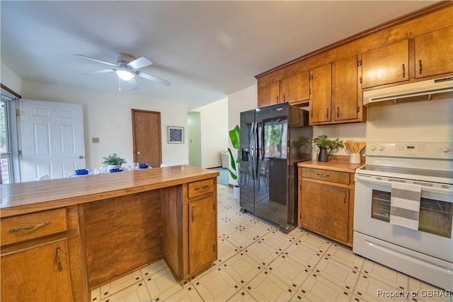 kitchen with white range with electric stovetop, black fridge, and ceiling fan