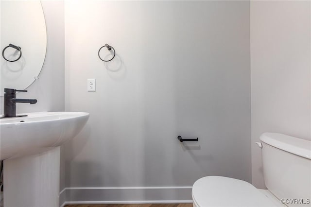 bathroom with toilet and sink