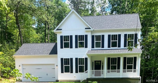 view of front facade featuring a porch, a garage, and roof with shingles