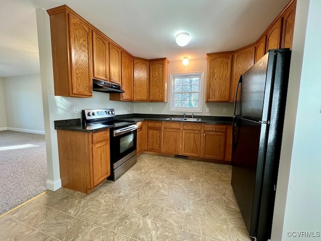 kitchen with black refrigerator, light colored carpet, stainless steel electric range oven, and sink