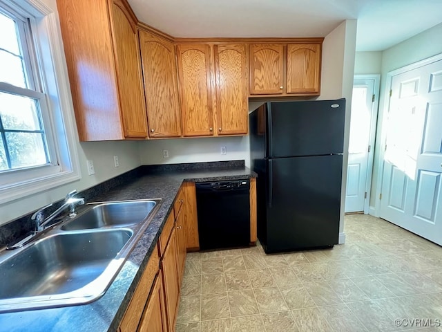 kitchen featuring sink and black appliances