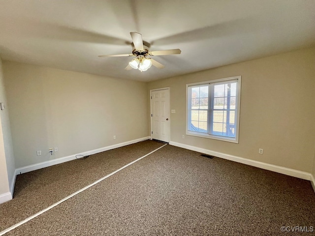 unfurnished bedroom featuring dark colored carpet and ceiling fan